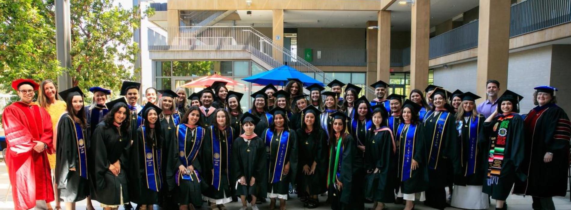 Faculty and students in graduation regalia
